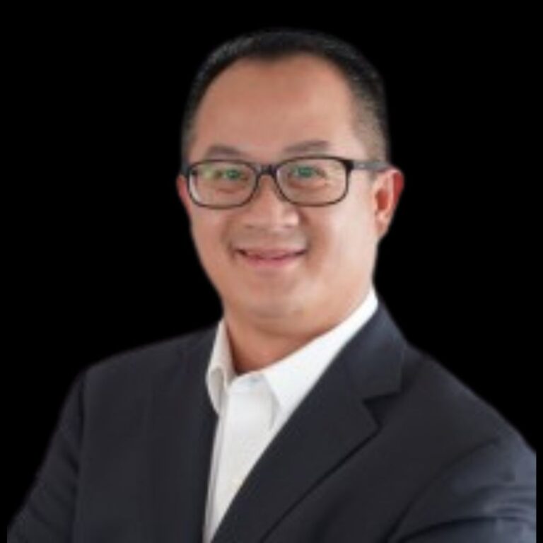 man with a smile in glasses and white shirt and business suit coat